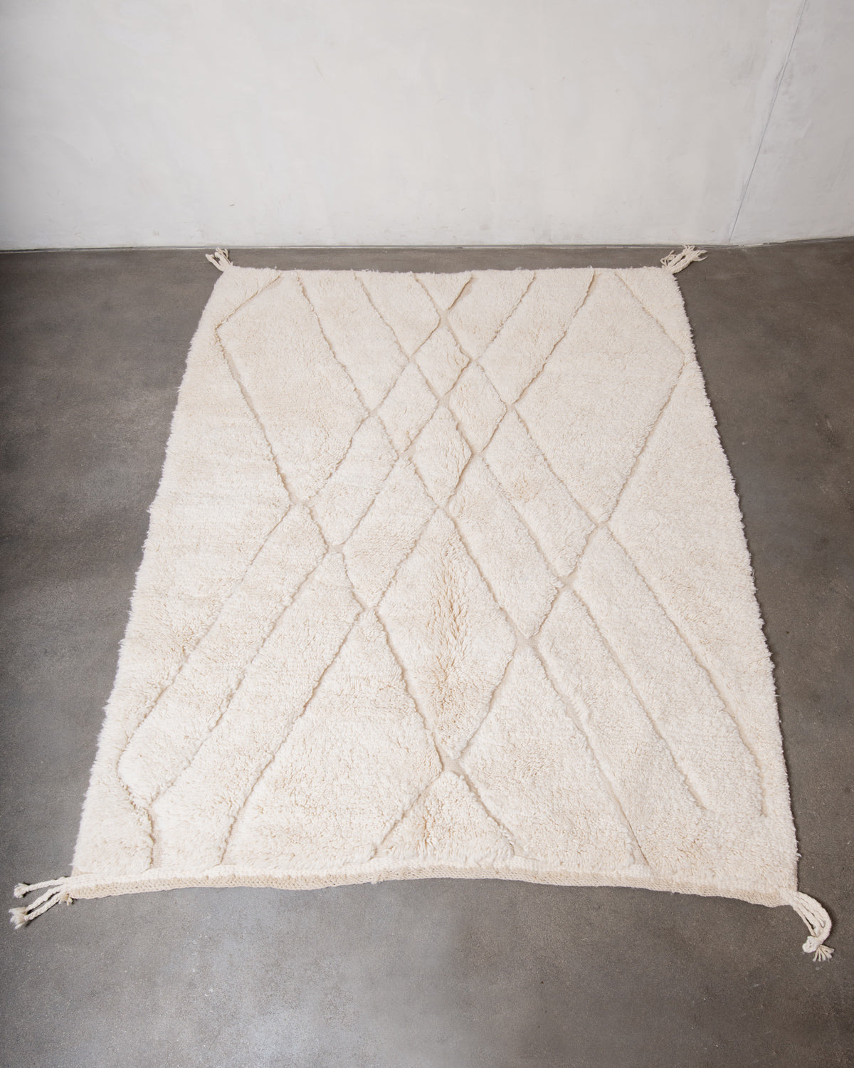 Modern, designer, handcrafted Berber rug from Morocco. Beniourain carpet with minimalist design, natural wool pile and a fluffy texture.